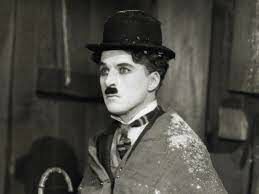 Образ Бродяги принес мировую популярность Чарли Чаплину. Впервые он появился в фильме...